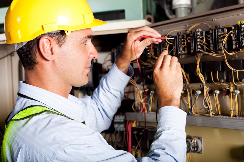 Electrician working on a circuit board